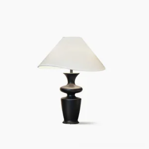 Rhodes mid-century modern table lamp with sculptural black wood base and asymmetrical white fabric shade, studio product shot
