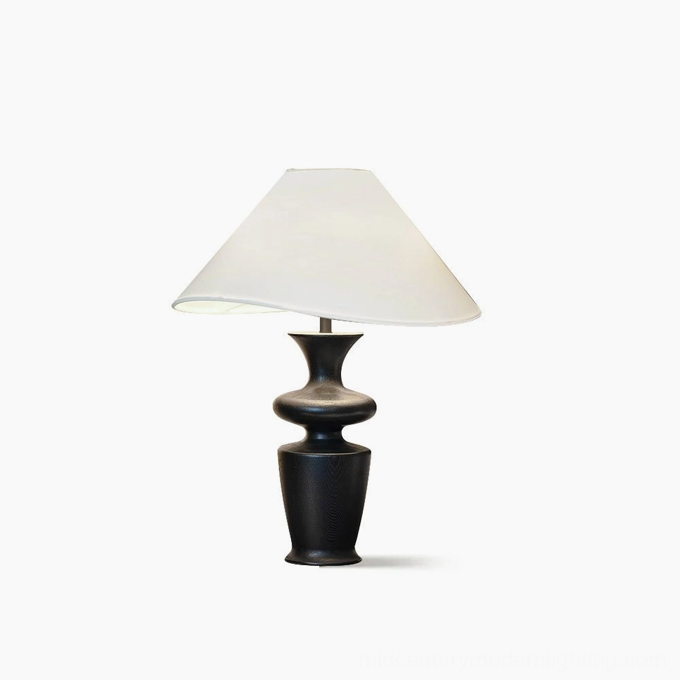 Rhodes mid-century modern table lamp with sculptural black wood base and asymmetrical white fabric shade, studio product shot