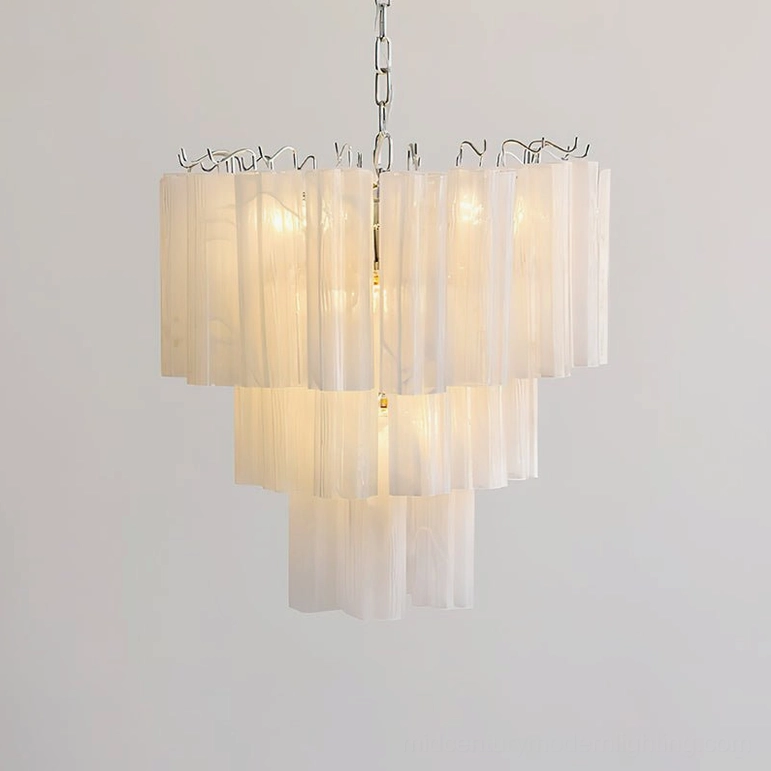 White tiered glass chandelier in formal dining setting showing architectural elegance