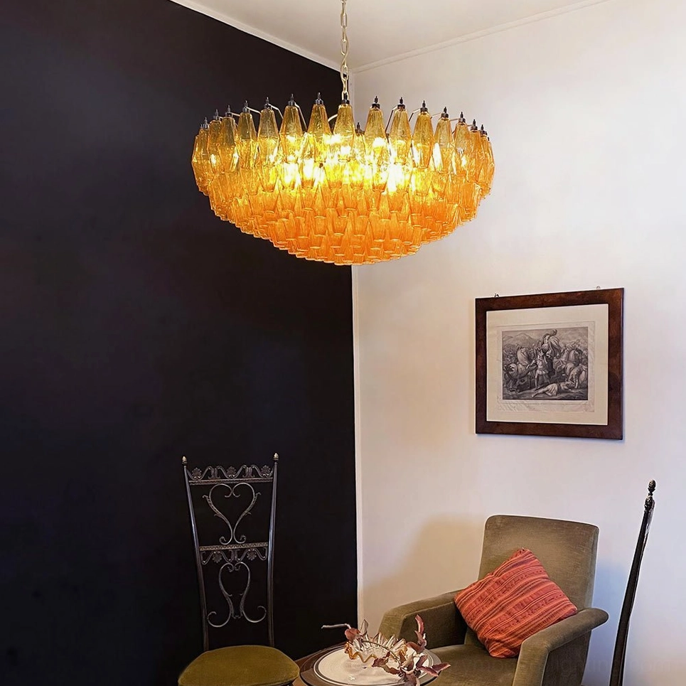 Rhombus Murano chandelier showing 141 glass pieces arranged in sculptural linear composition with gold hardware