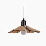 Riankh woven pendant light with floral petal shade hanging against white studio background, dark metal base with exposed warm bulb