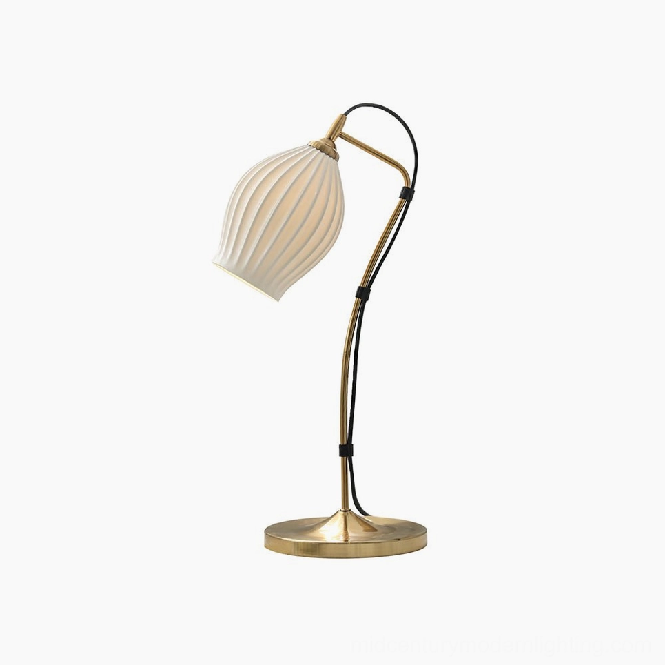 Brass ribbed table lamp with warm gold metal finish, studio lighting on white background, mid-century modern design