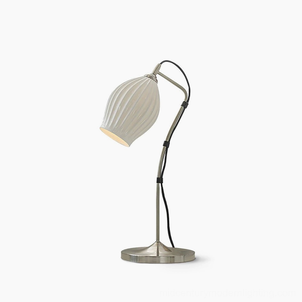 Ribbed ceramic table lamp with white bone china shade, front three-quarter view on studio white background, modern minimalist lighting design