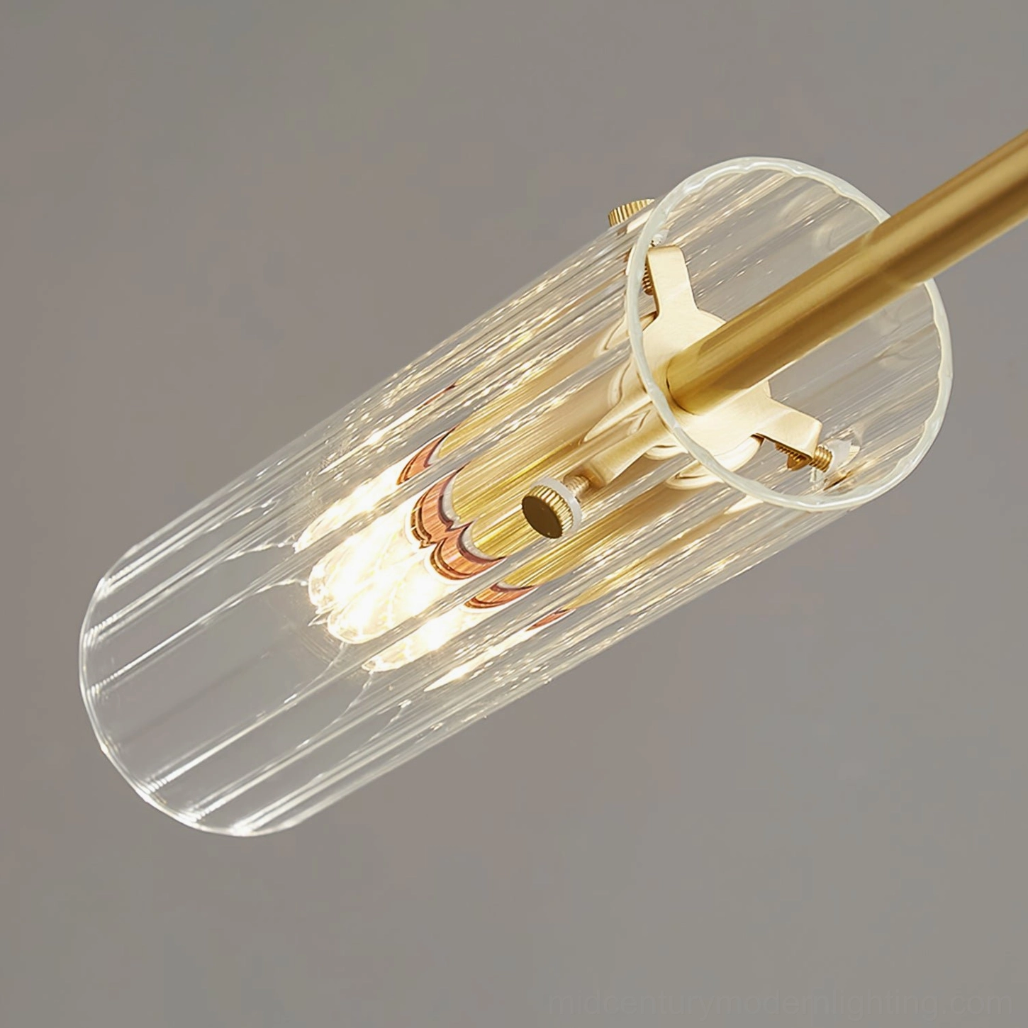 Ribbed glass chandelier shade close-up side view fluted texture brass hardware