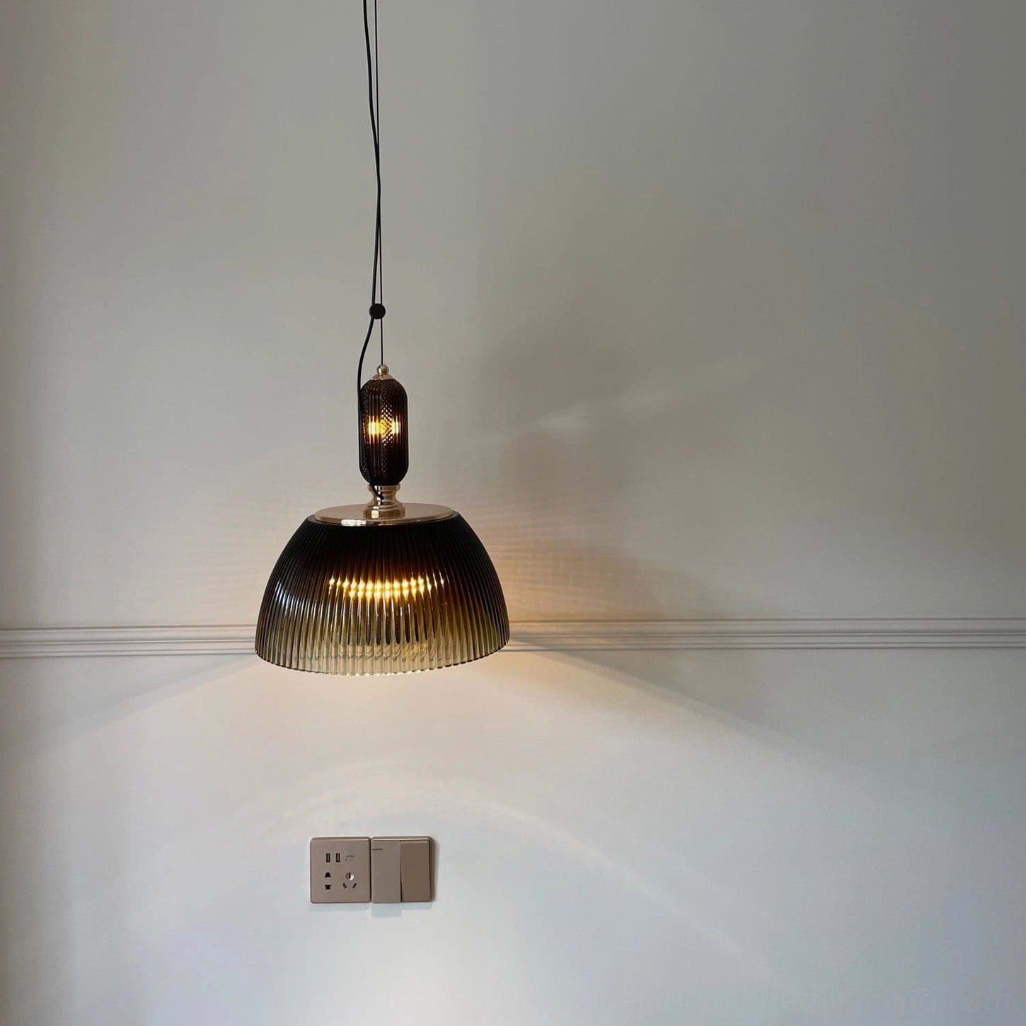 Mid-century modern ribbed glass pendant lamp detail showing craftsmanship of hand-finished glass ribbing pattern