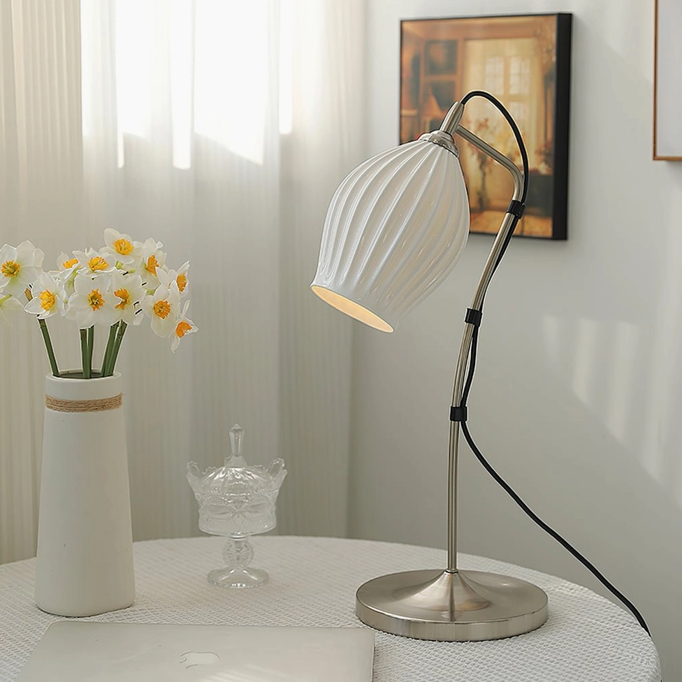 Ribbed ceramic table lamp compact size model white ceramic shade on studio background