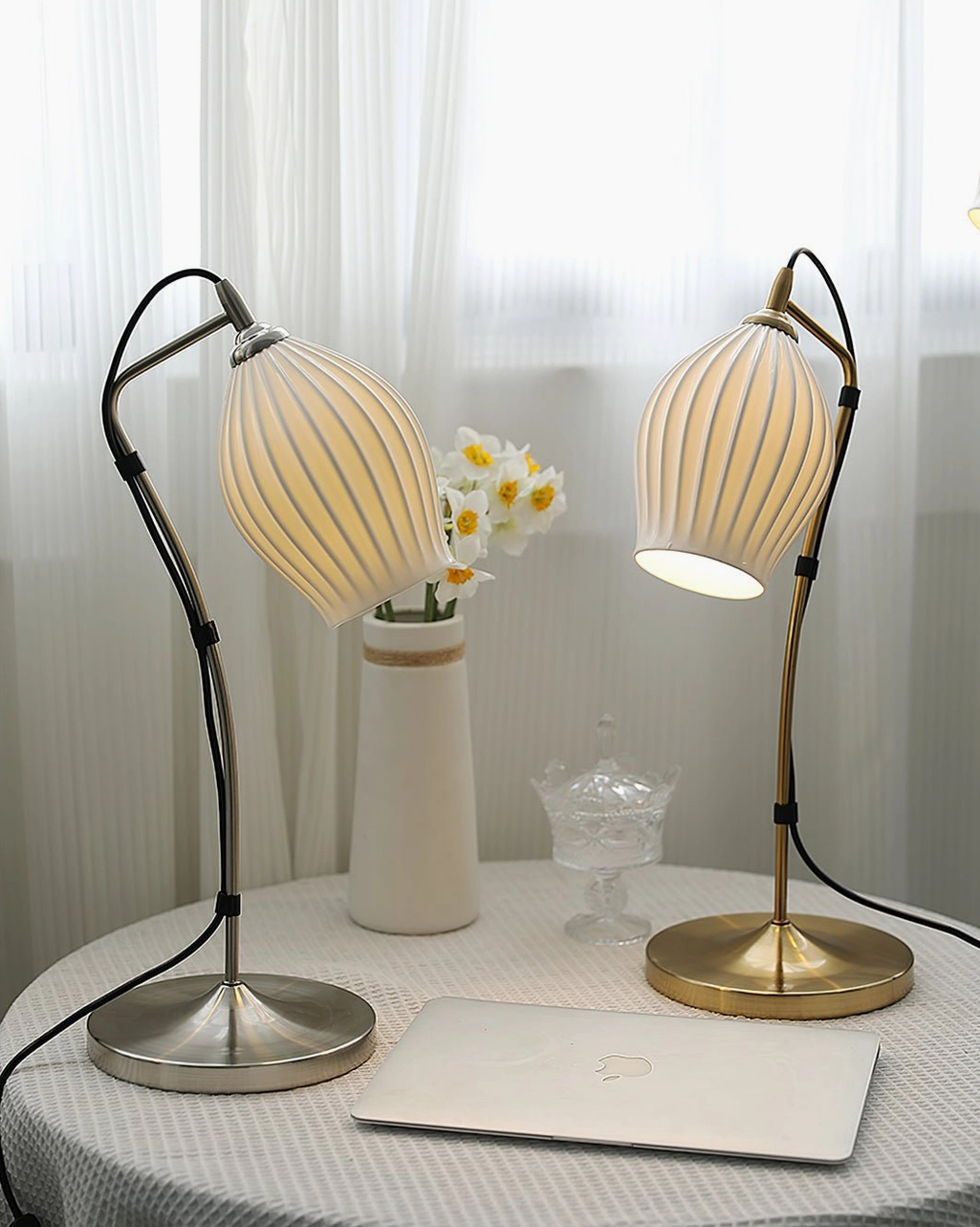 Ribbed ceramic table lamp with dramatic side lighting emphasizing organic texture and sculptural form