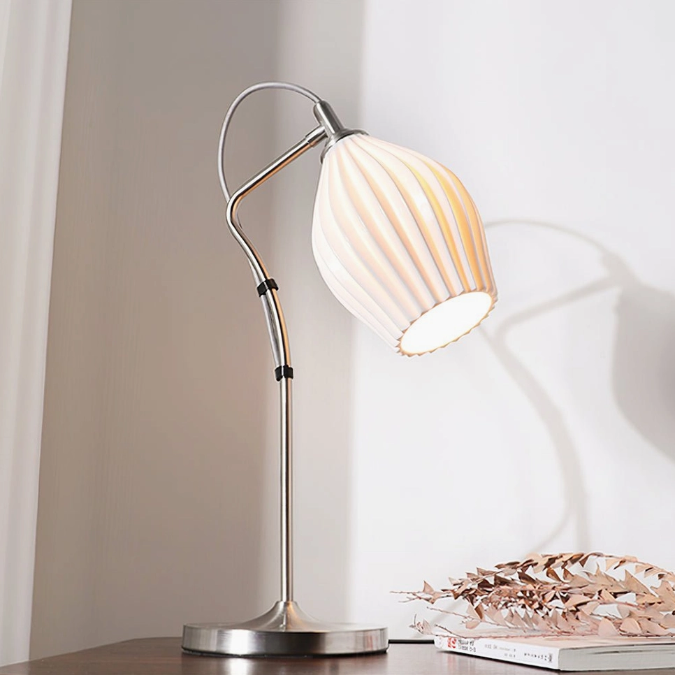 Ribbed ceramic table lamp three-quarter side angle showing depth of organic ribbed ceramic texture