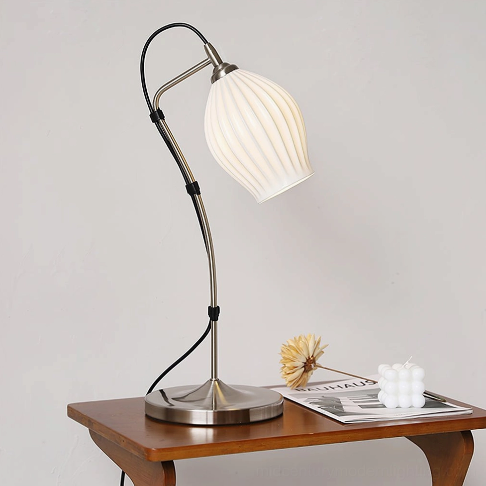 Silver ribbed ceramic table lamp displayed on home side table with dried floral arrangements and candle decor styling