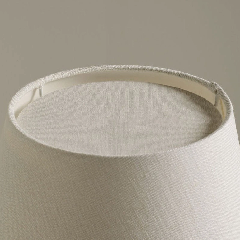 Interior overhead view of off-white woven fabric lampshade showing internal metal mounting frame and fabric texture