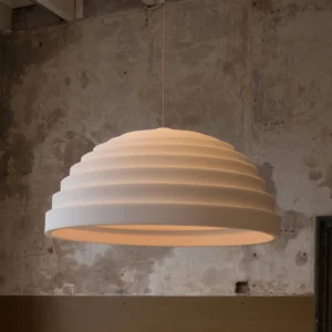 Rice Field Acoustic Pendant Lamp three-quarter view industrial space warm lighting
