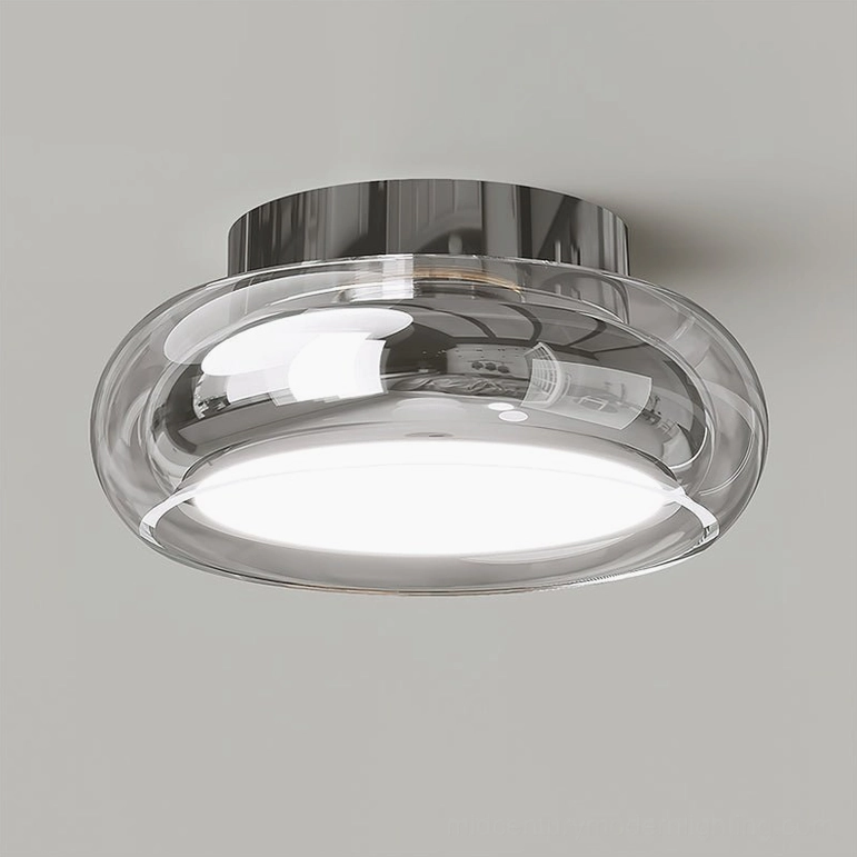 Clear and silver Richard ceiling lamp with bright warm light on light gray background