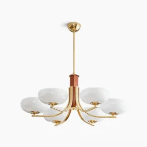 Six-arm Rico mid-century modern chandelier with brass gold finish and opal white glass shades, overhead studio view