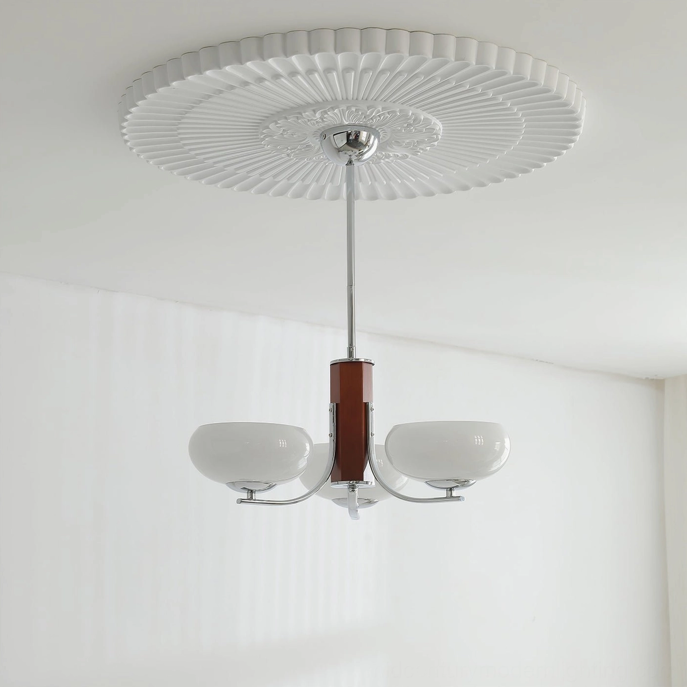 Rico chandelier with chrome finish and wood column in contemporary home