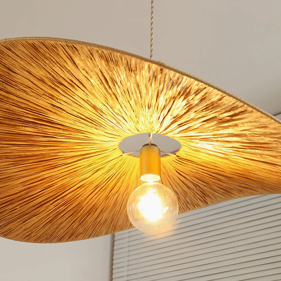 Close-up detail of Ridotti hand-woven rattan shade showing radial woven texture and natural material craftsmanship