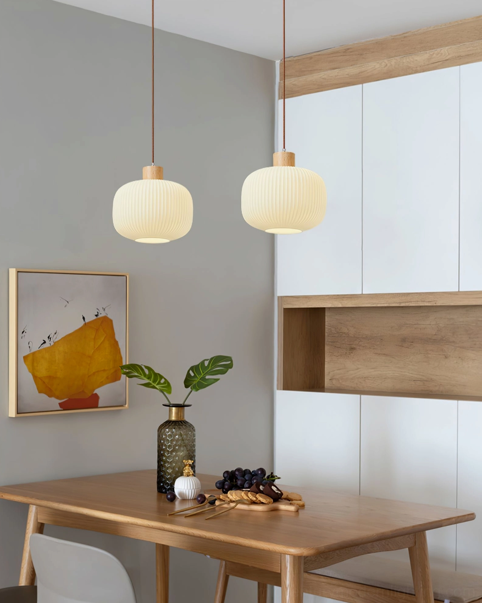 Model A Rime pendant lamp slender oval silhouette against neutral wall background