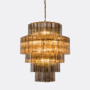 Amber-toned Rina Firenze chandelier displaying layered glass prisms and warm luminous quality, overhead close-up
