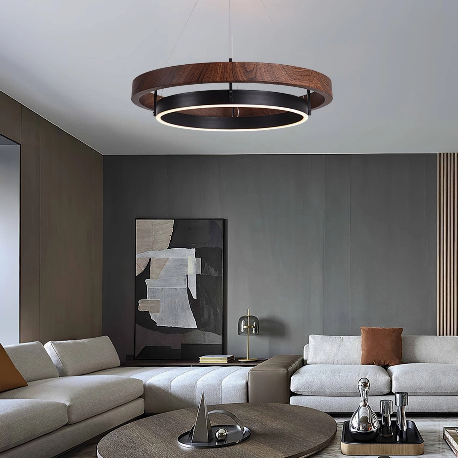 Ring Dunst modern chandelier illuminated in contemporary living room with sectional sofa overhead view