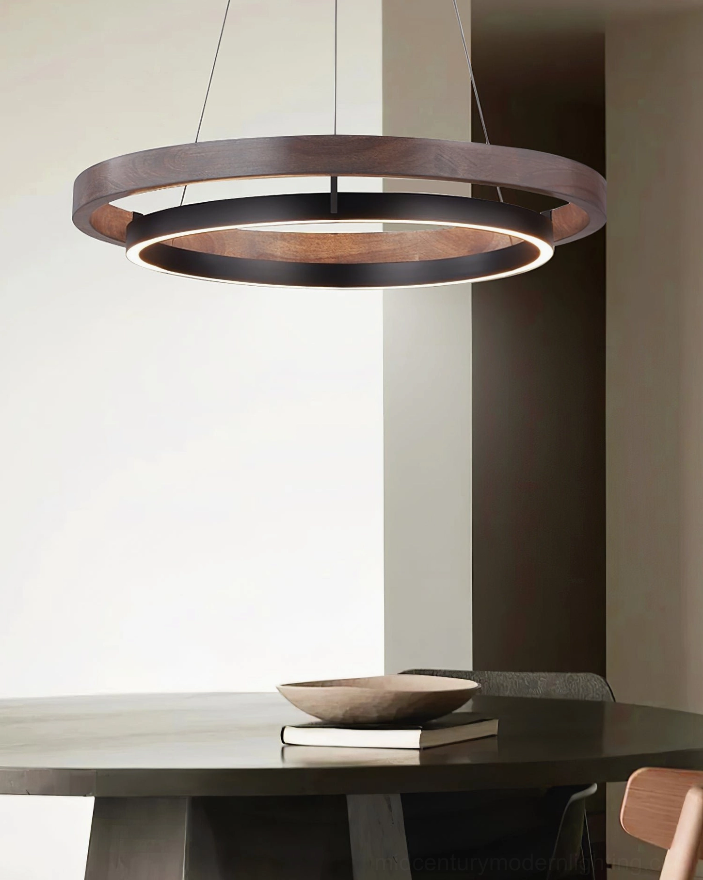 Modern Ring Dunst pendant light suspended in minimalist dining room with neutral furnishings