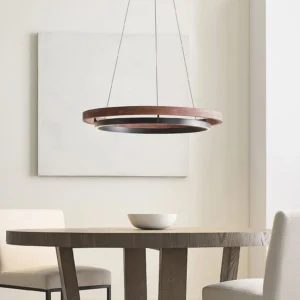 Modern double-ring pendant light installed in contemporary dining room with warm ambient lighting
