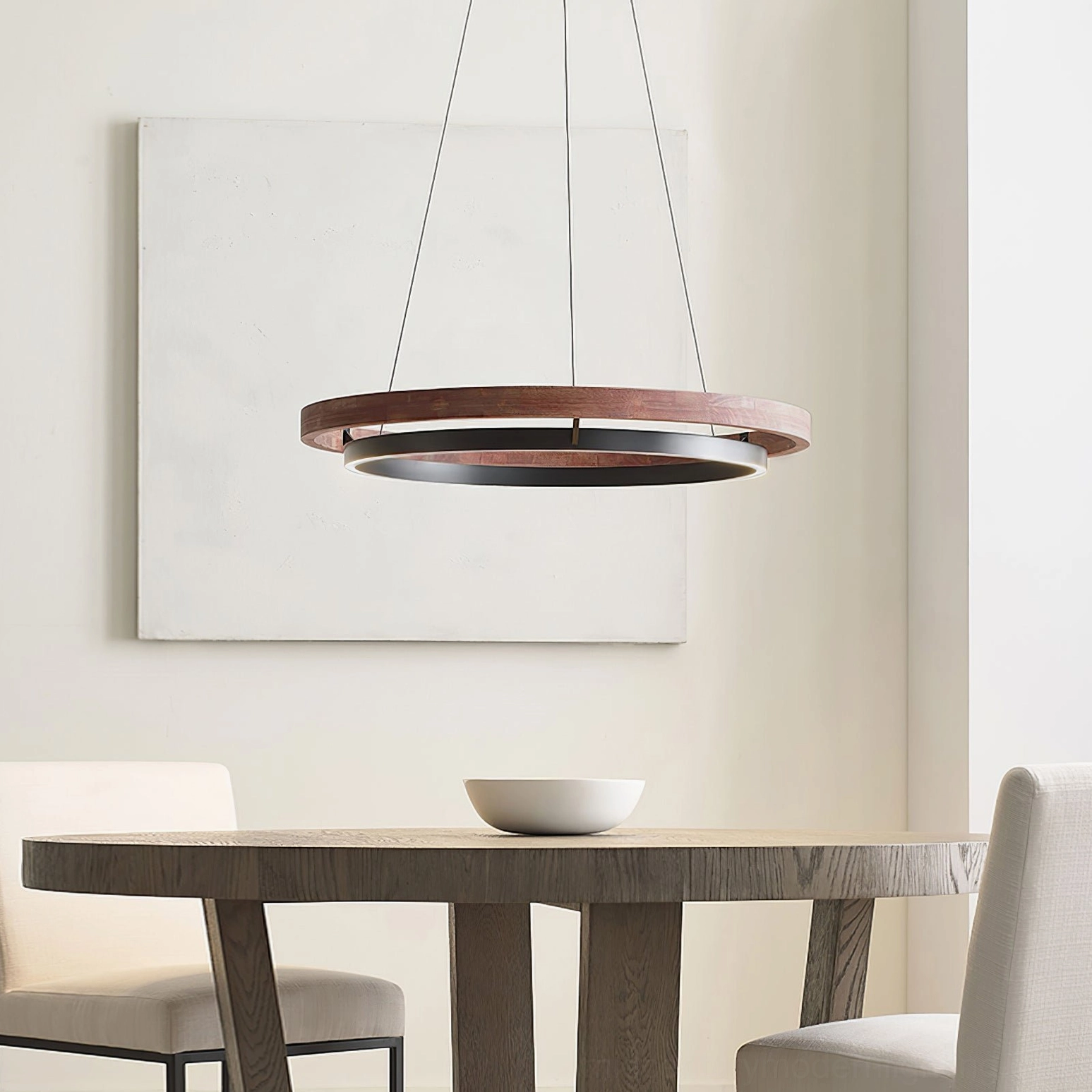Modern double-ring pendant light installed in contemporary dining room with warm ambient lighting