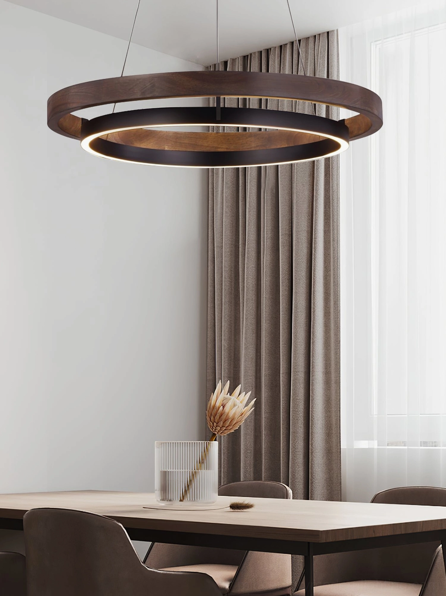 Double-ring modern pendant light in contemporary residential interior showing integrated LED glow