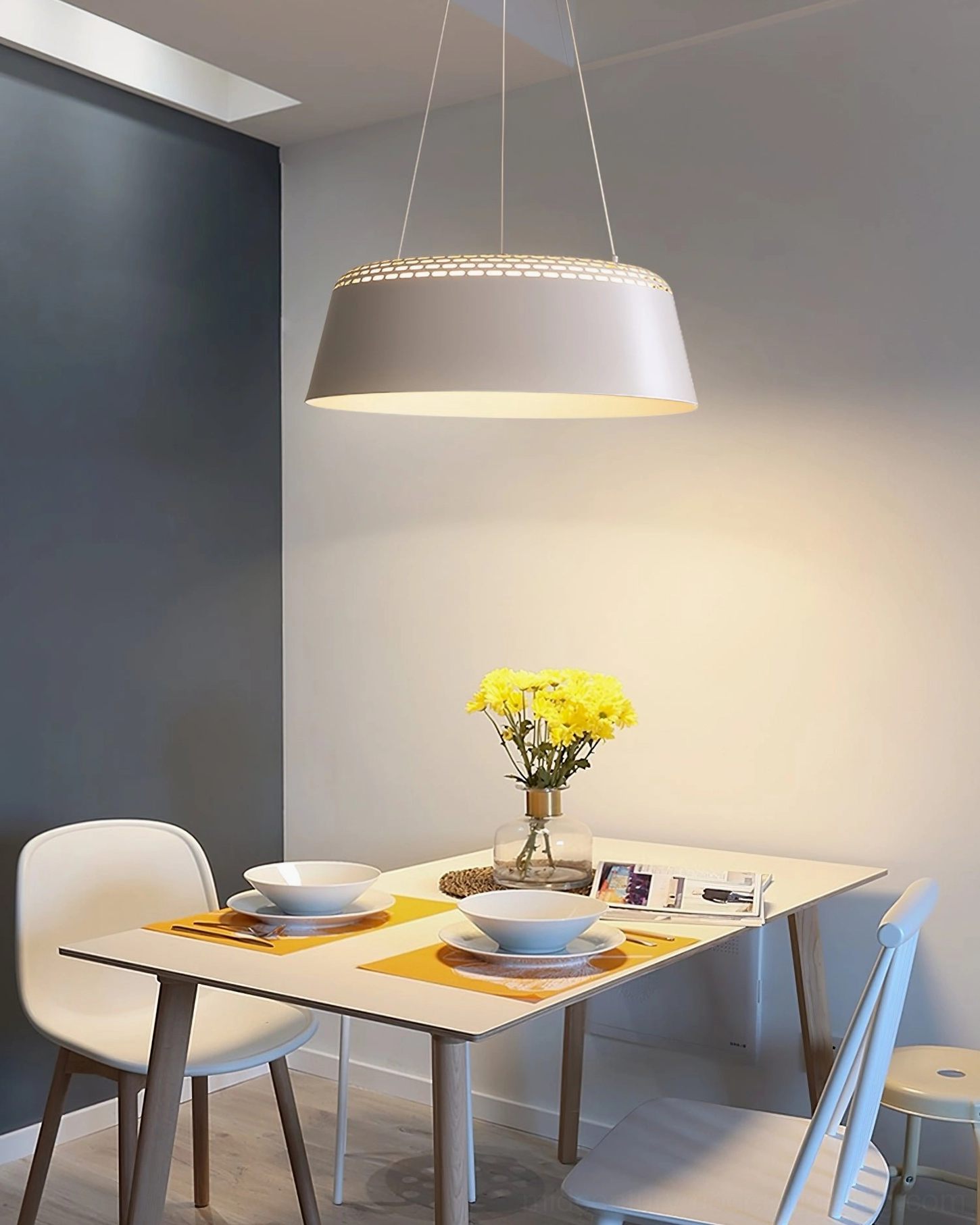 Ring modern pendant light interior décor shot with contemporary furnishings and neutral palette