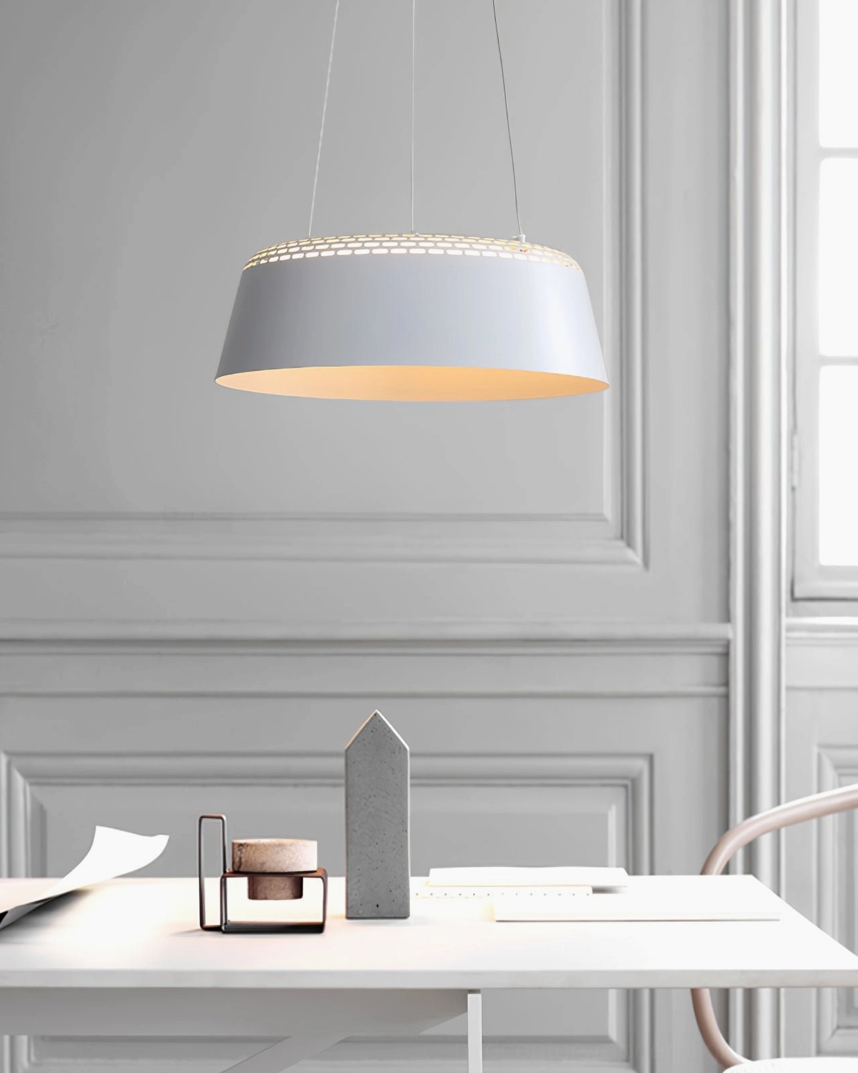 Ring drum pendant above kitchen island workspace providing even task lighting without glare