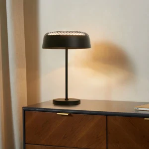 Ring T1 modern table lamp in black finish on bedroom wooden nightstand, three-quarter side angle