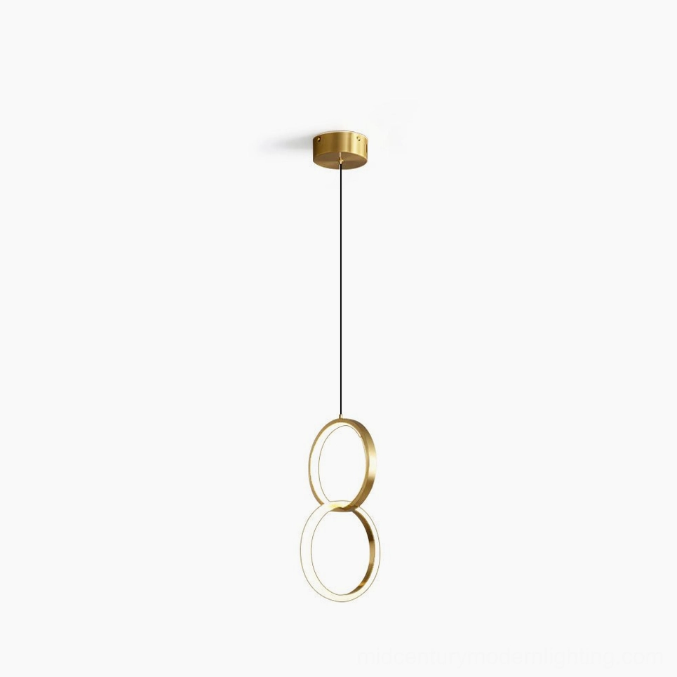 Rings pendant lamp double stacked brass rings with integrated LED glowing warm light front view