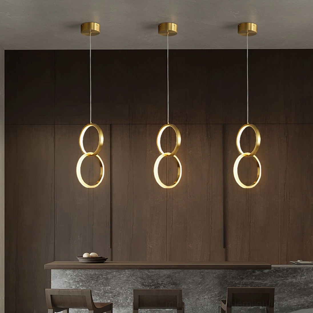 Rings stacked brass pendant lights modern kitchen bar dark wood accent wall minimalist luxury
