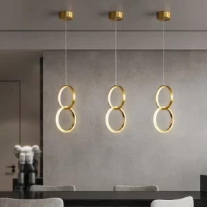 Rings modular pendant lamps triple set installed modern dining room concrete wall warm brass LED