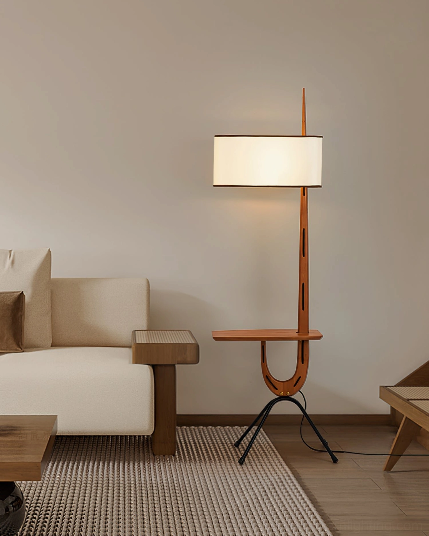 Rispal Floor Lamp in minimalist beige living room paired with small wooden side table, three-quarter view of complete mid-century setup