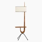 Rispal Giraffe Floor Lamp with integrated walnut wood console shelf and white fabric drum shade on slim black iron tripod base, front studio view