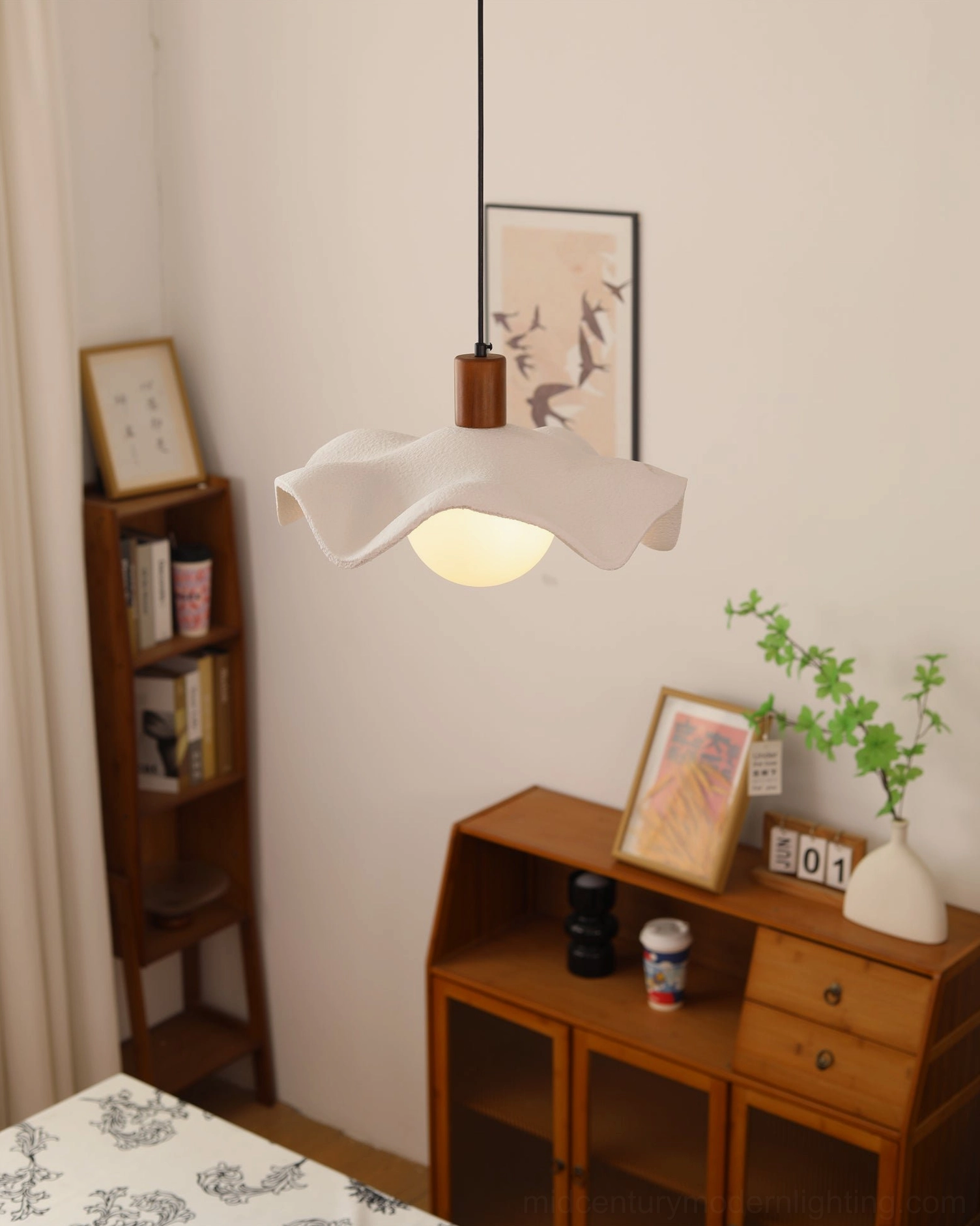 Rivale wavy pendant light in vintage boho bedroom wooden furniture green plants