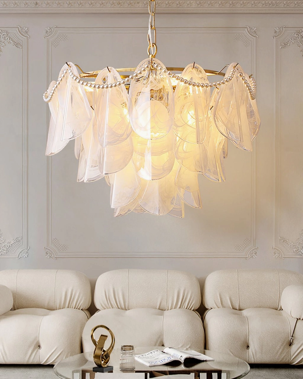 Rondini chandelier in modern living room setting with tufted sofa, soft ambient glow, contemporary luxury interior