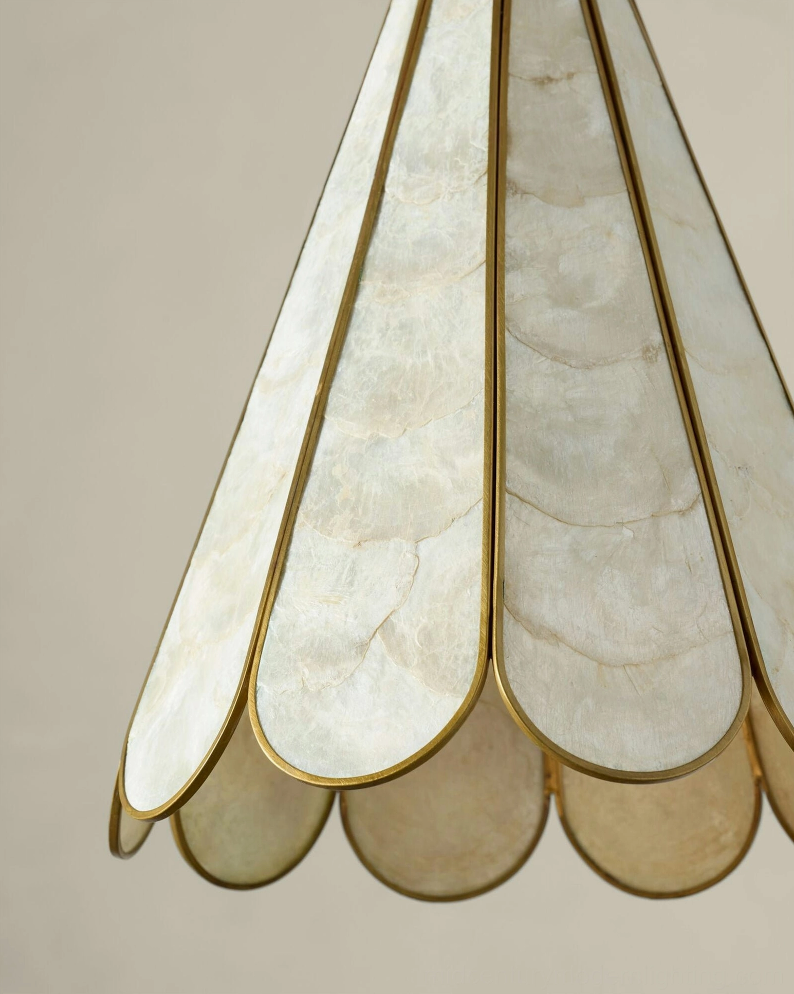 Close-up detail of Rosalind Capiz Petal Pendant Light shade showing individual shell pieces and brass edging