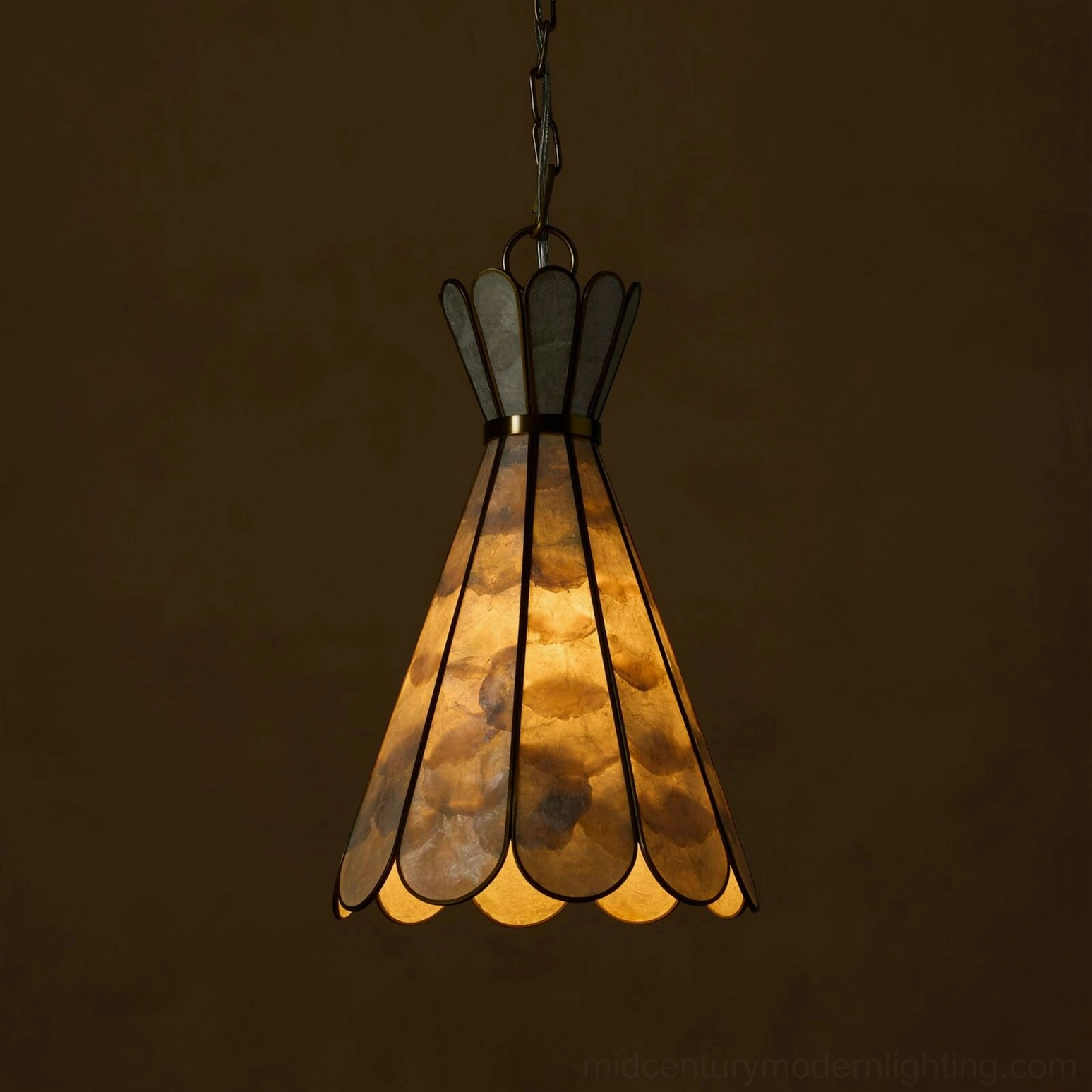 Rosalind Capiz Petal Pendant Light illuminated with warm amber glow showing shell panel translucency