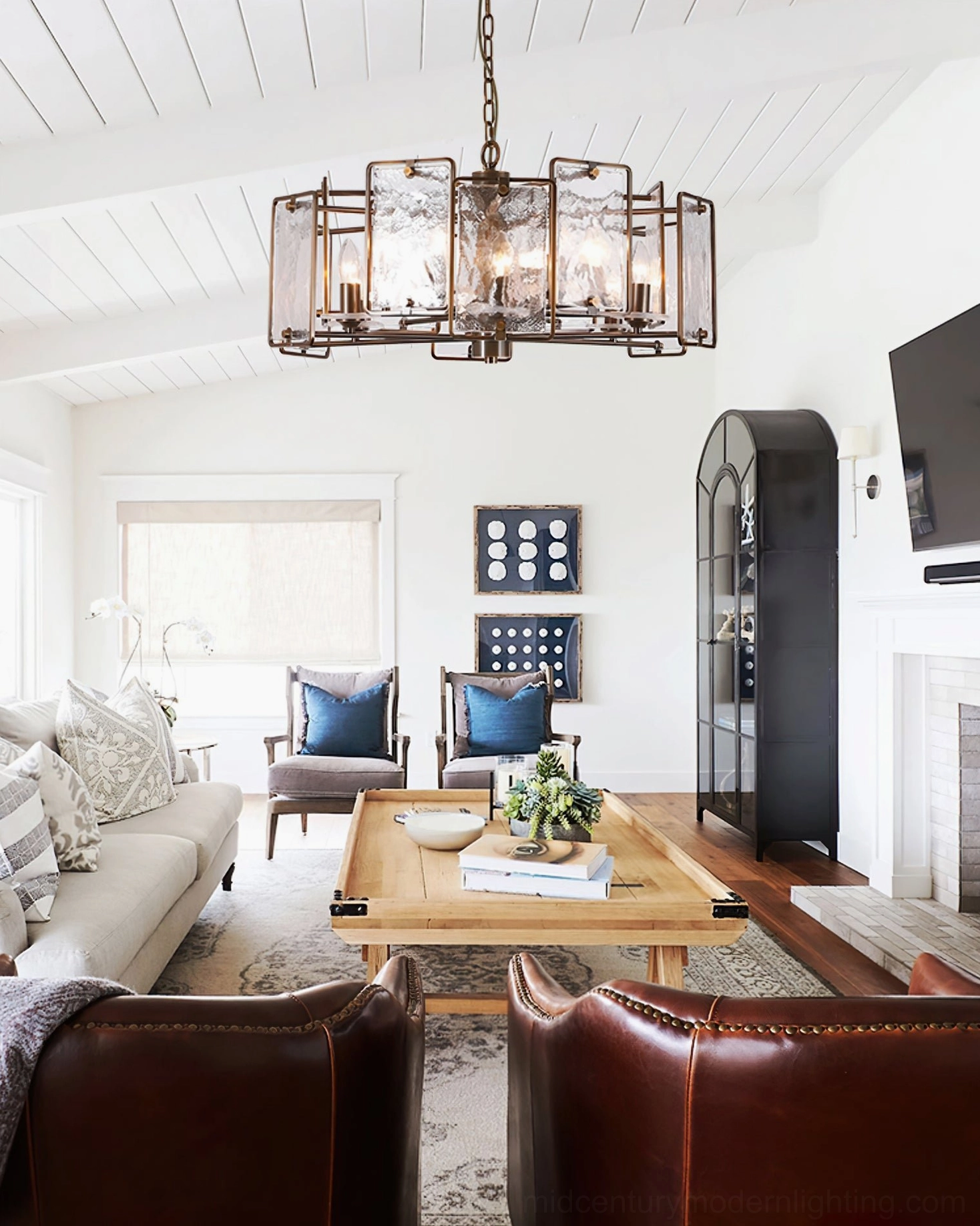 Rosalind geometric glass chandelier in bright farmhouse living room with leather seating