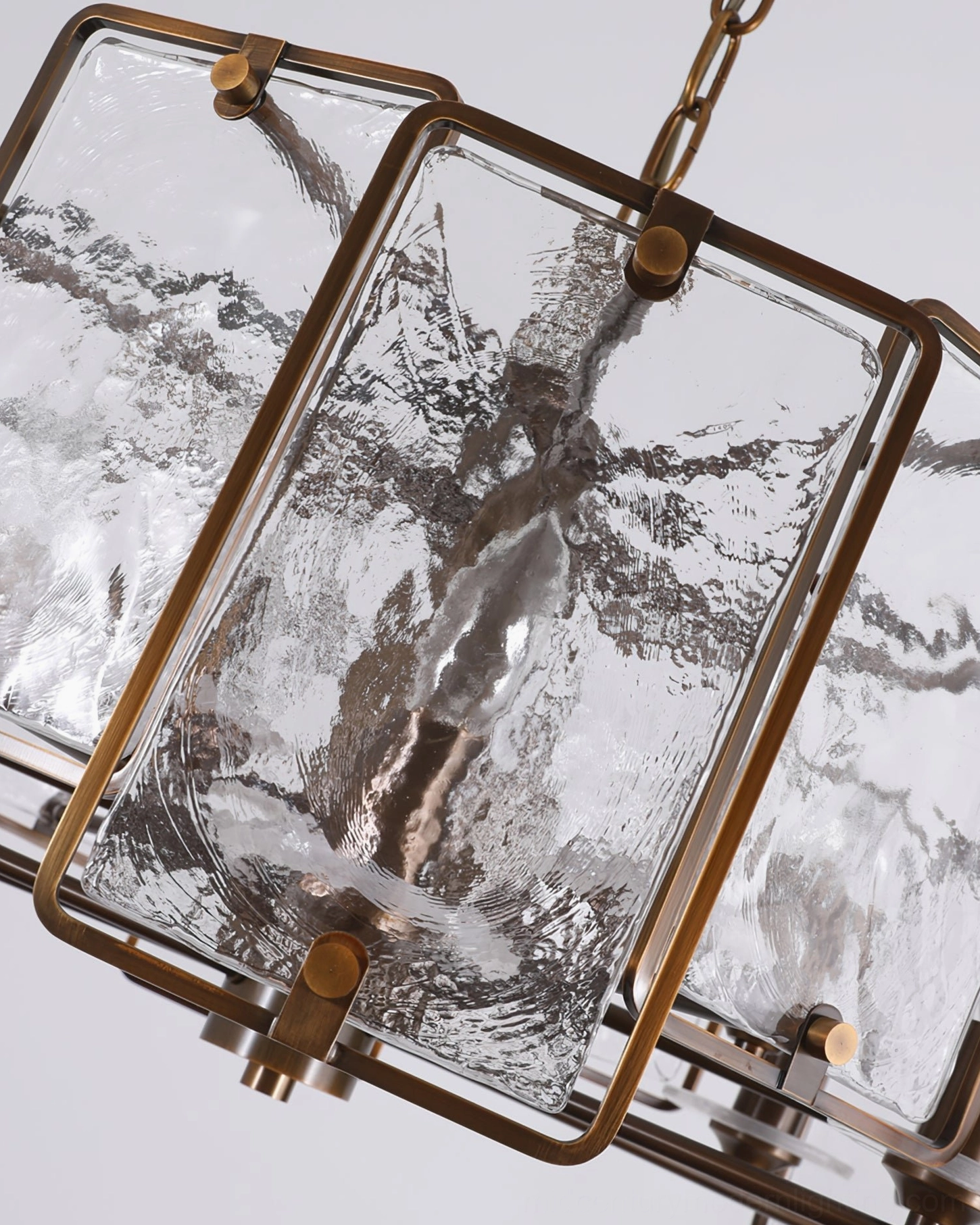 Rosalind chandelier close-up detail of rippled textured glass panels with bronze hardware