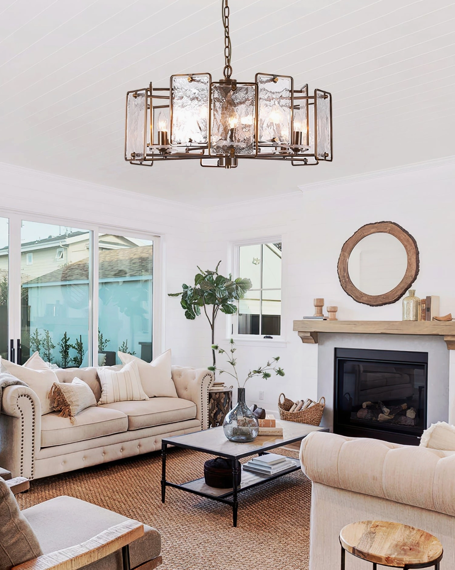 Rosalind glass chandelier in cozy sunny living room with large windows and beige tones