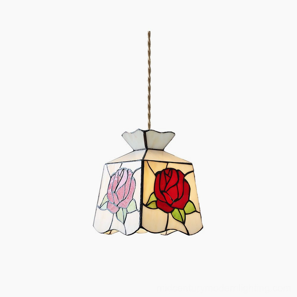 Handcrafted rose stained glass Tiffany pendant lamp with crimson and pink floral patterns, front view against white studio background