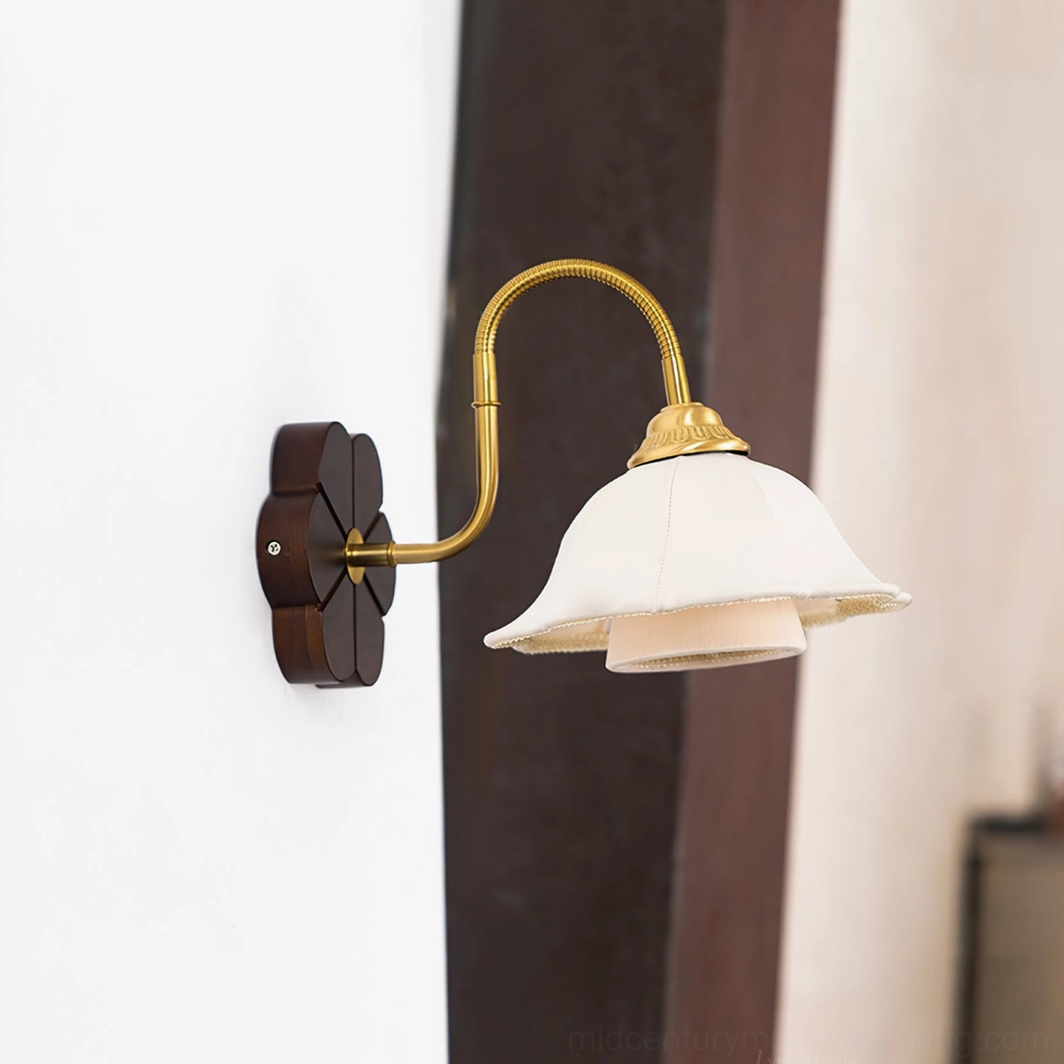 Rosette wall sconce installed in vintage farmhouse interior with dark wood panel decor