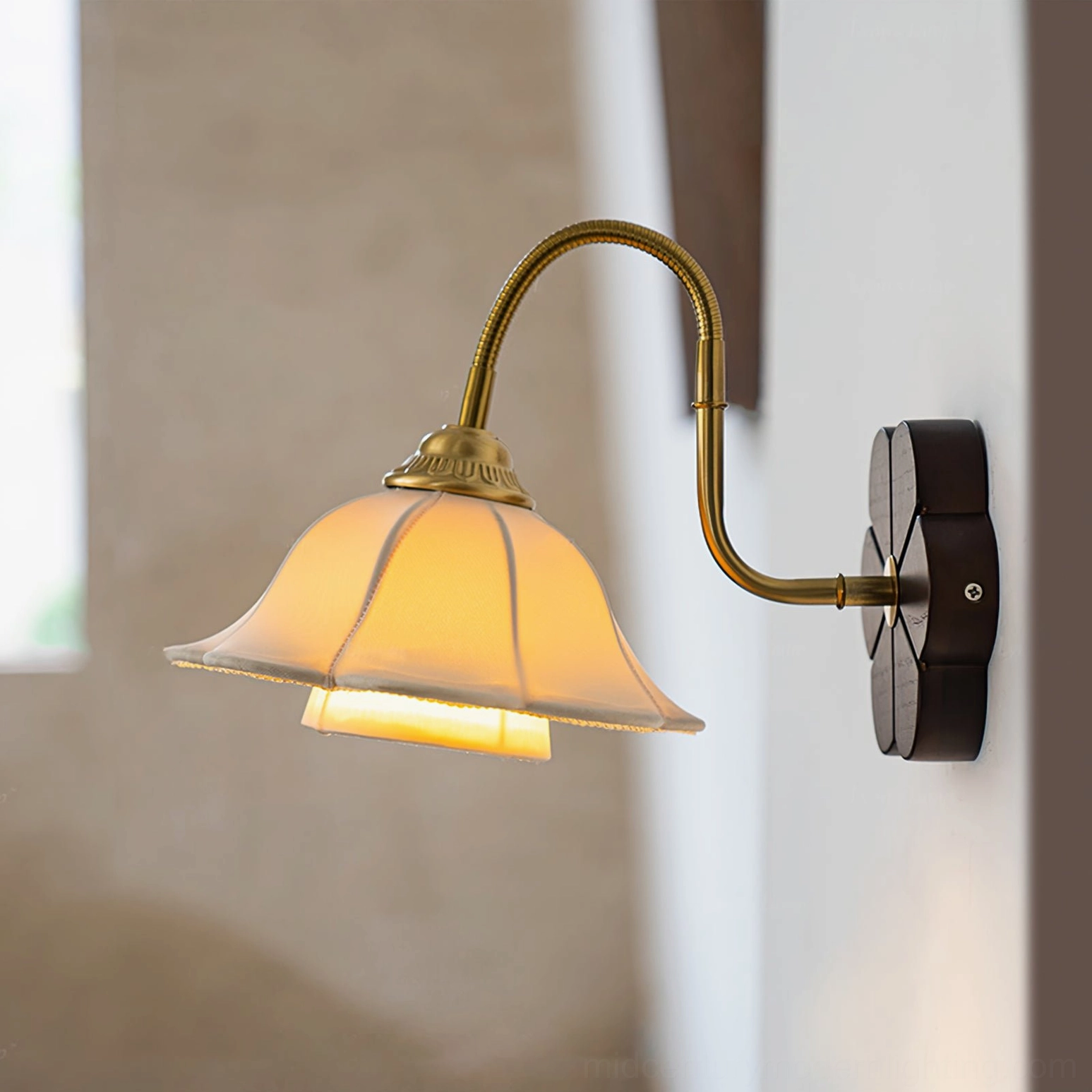 Lit Rosette wall sconce with glowing warm yellow light and detailed scalloped fabric shade view
