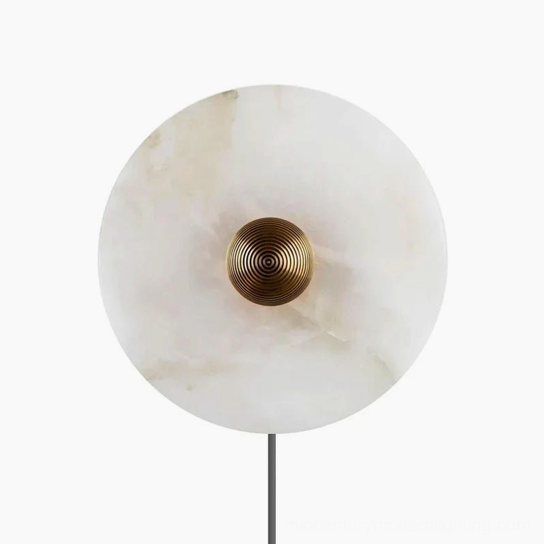Round alabaster plug-in wall sconce with gold metalwork finish and natural stone aesthetic