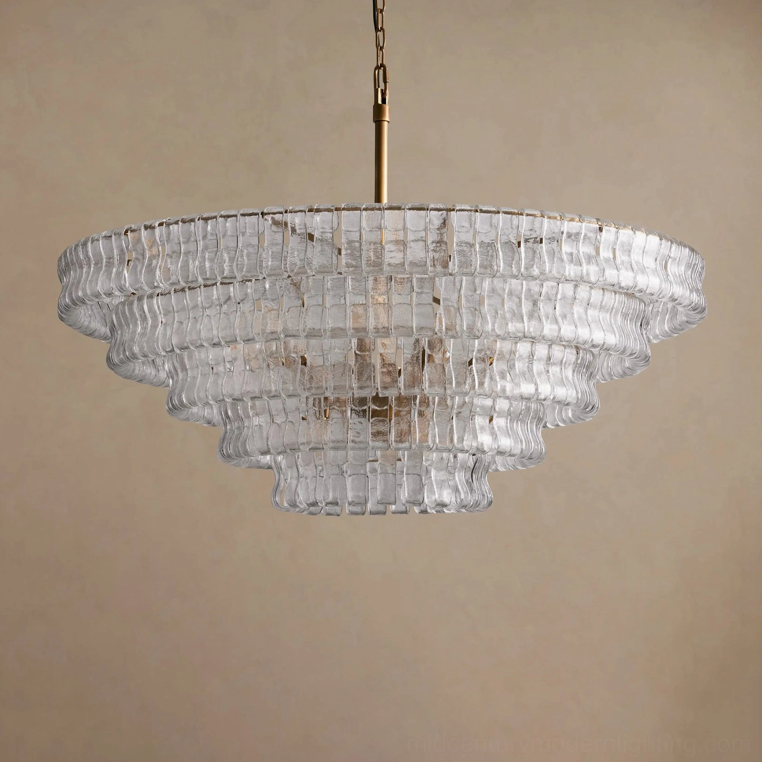 Round tiered chandelier with artisanal ice-textured glass, industrial frame construction, architectural lighting design