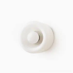 Pair of minimalist round white glass wall lamps on white background, modern minimalist design