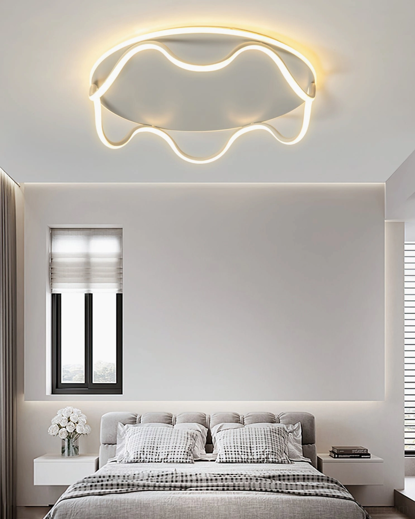Contemporary rounded wave LED ceiling light with warm illumination in minimalist Nordic bedroom interior