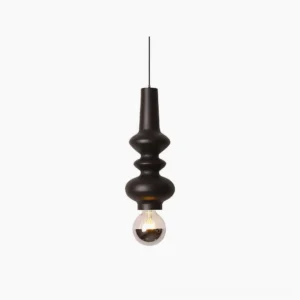 Rudd matte black cylindrical pendant light with stacked cylinder design and exposed bulb, front studio view