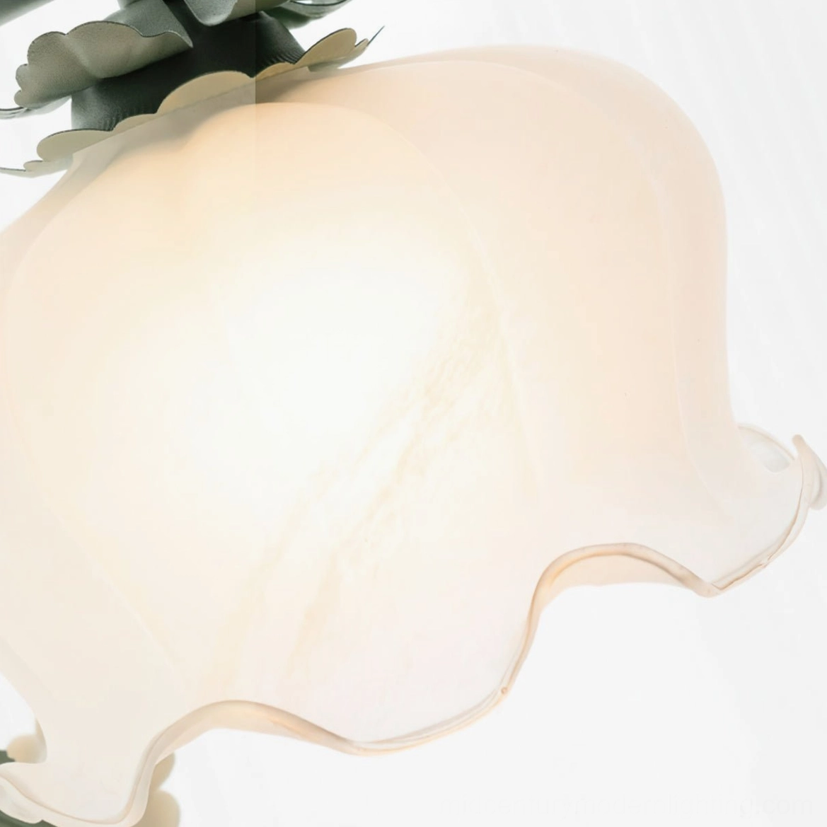 Close-up detail of frosted milk-white ruffled glass lampshade with wavy edge design